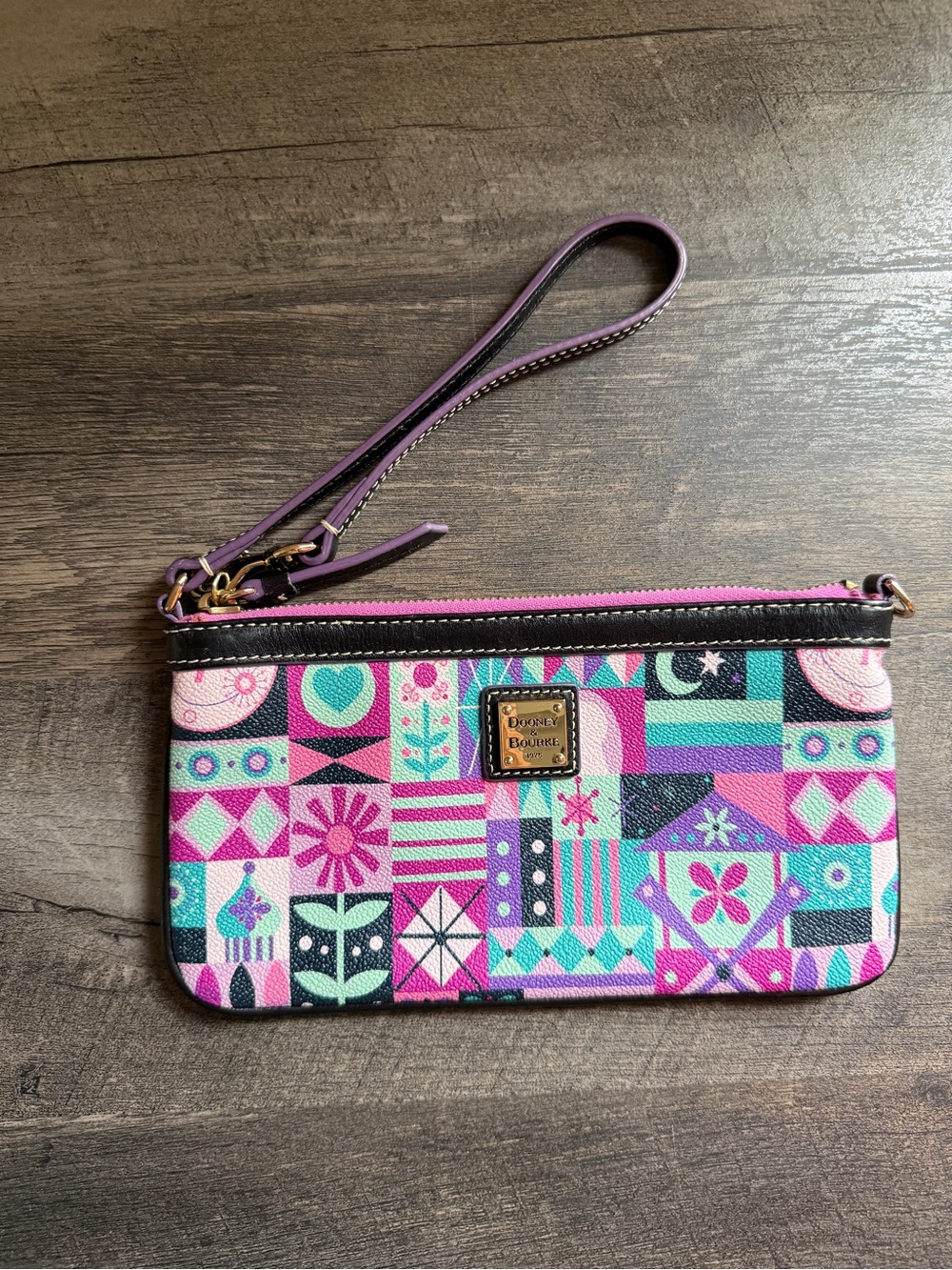 Dooney & Bourke Purple Pink Teal It’s a Small World Disney Wristlet